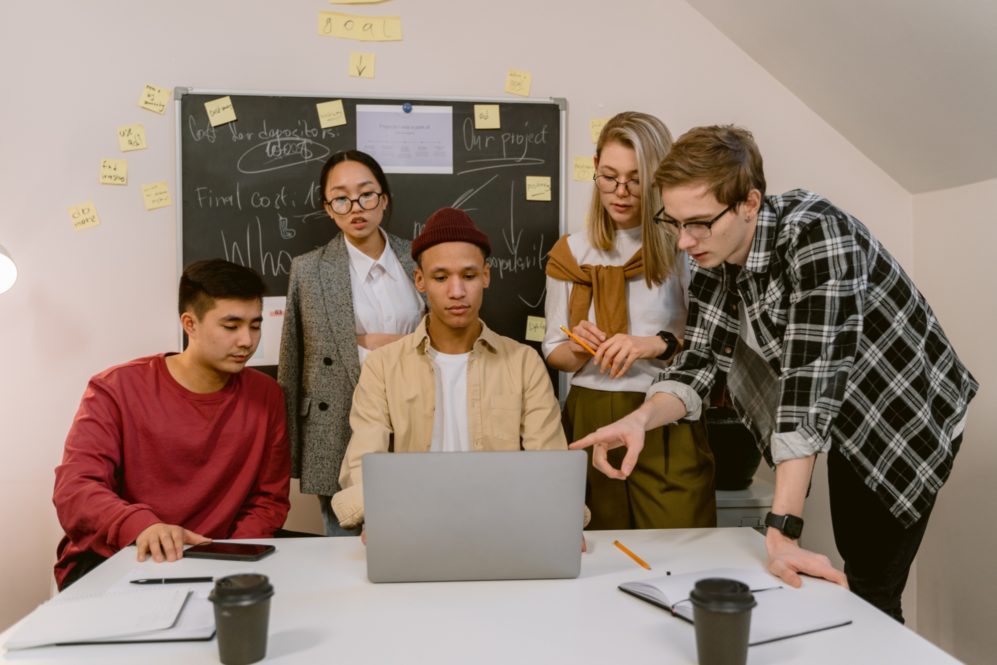 Group working around a laptop